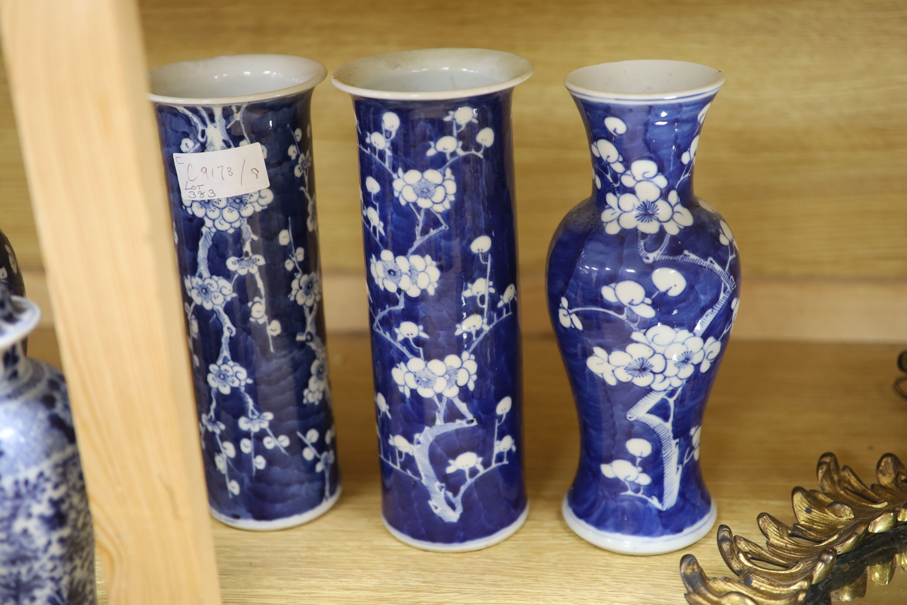 Four Chinese prunus pattern vases and a vase and cover, tallest 26.5cm